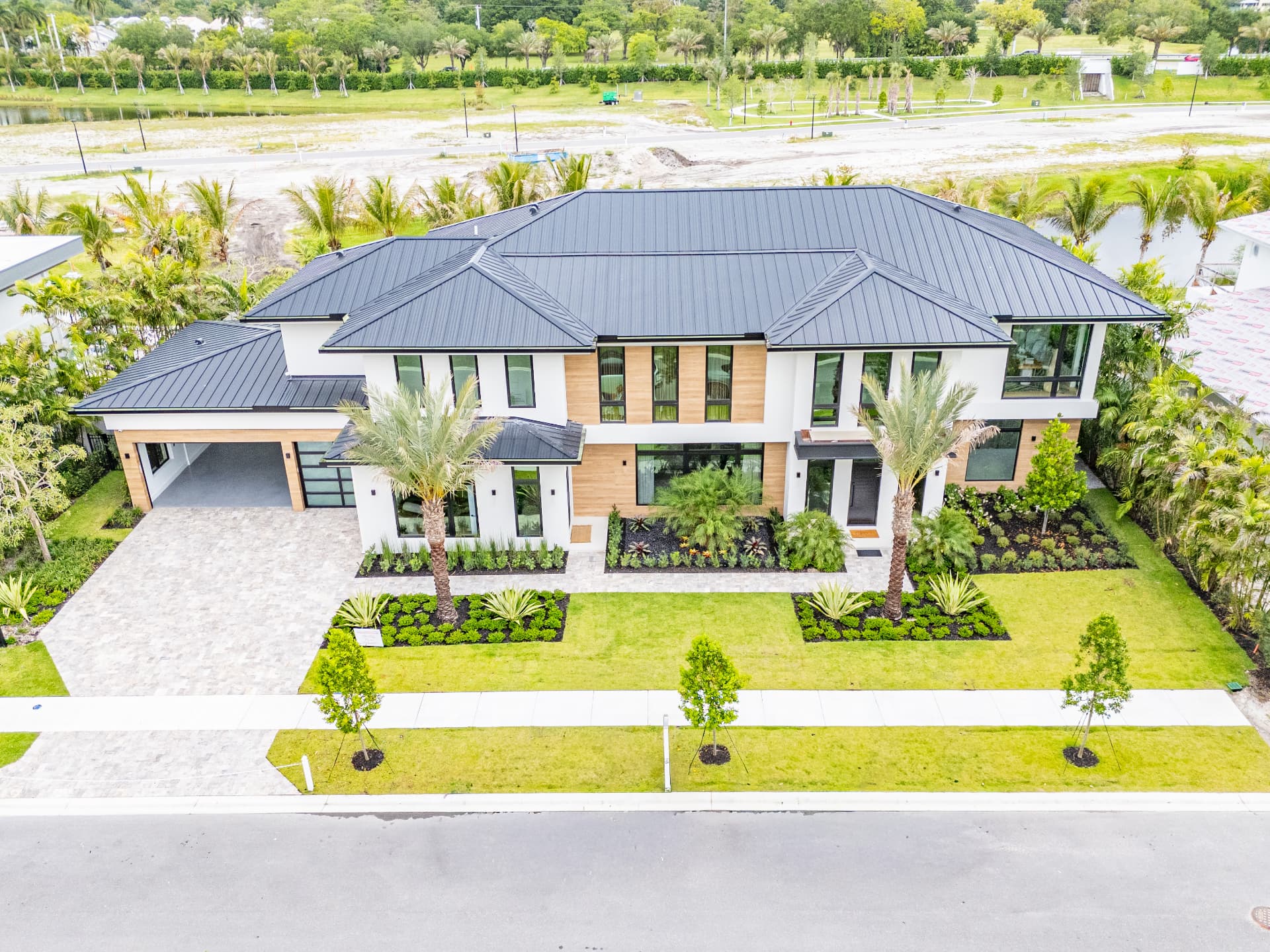 Front elevation of a completed two-story custom home at Farrell Estates in Wellington, Florida