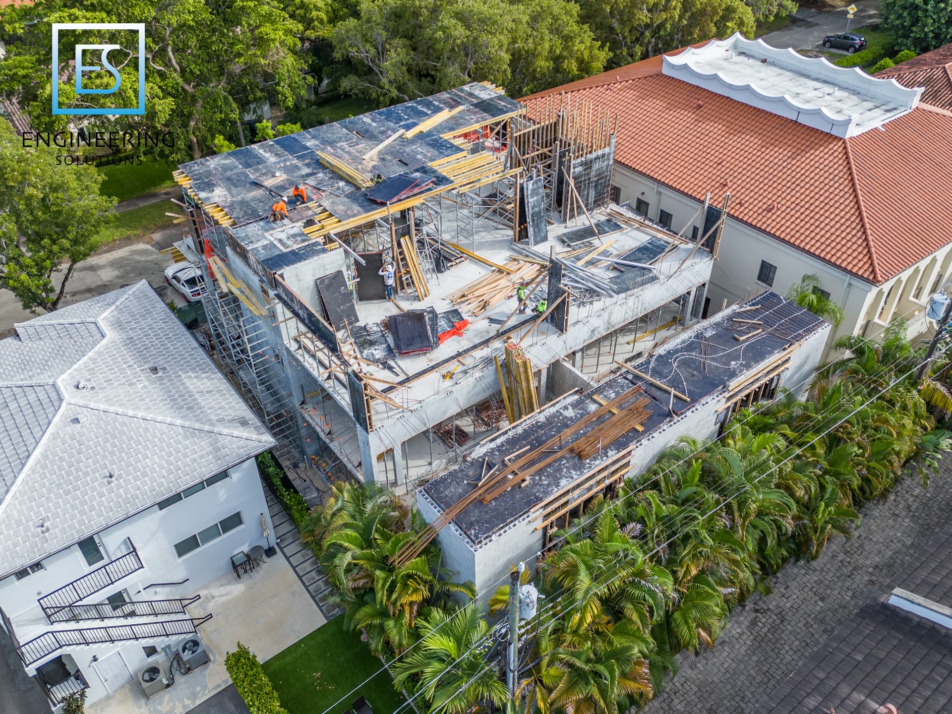 Crews placing formwork for the upper post-tensioned slab at Malaga Townhomes in Coral Gables, Florida