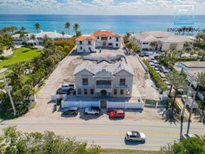 Coastal mansion under construction near the ocean.