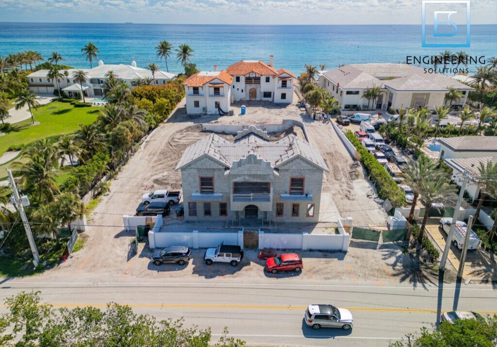 DJI_0985-1024x768-1 Coastal mansion under construction near the ocean.